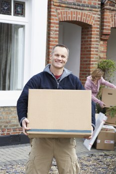 Furniture pick-up service removing a sofa from a Belsizepark home