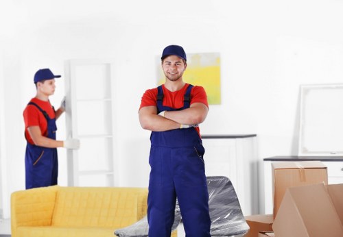 Removal team loading furniture in a Belsize Park street