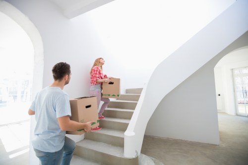 House removal team unloading boxes at a Belsize Park home
