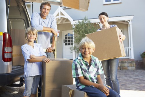 Boxes and furniture being loaded into a moving truck
