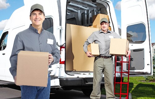 Worker checking a loaded vehicle and secure cargo before transit