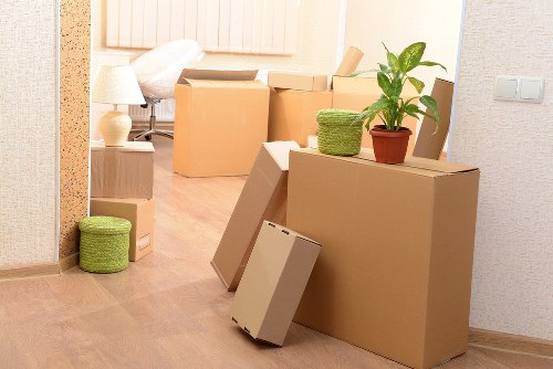 Loading household items into a removal truck for relocation