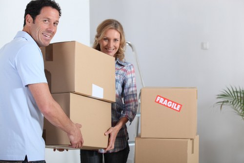 Local moving team handling boxes and furniture in Belsize Park